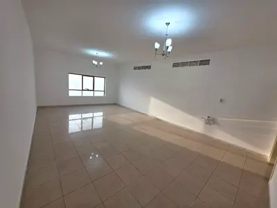 Three-bedroom apartment with a living room and a direct sea view for annual rent in Ajman Corniche