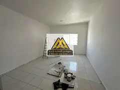 Studio for Annual Rent in Al Rashidiya 3 Ajman Spacious Layout Semi-Separate Kitchen Central AC Park