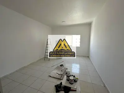 Studio for Annual Rent in Al Rashidiya 3 Ajman Spacious Layout Semi-Separate Kitchen Central AC Parking Available Prime Location