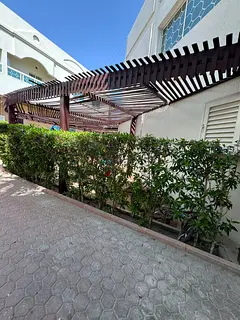 2BR + 2 living rooms in Al Khan, Sharjah. 3 baths, central AC, balcony, kids’ area, outdoor seatin