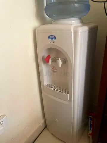 Used freestanding water cooler/dispenser with 5-gallon bottle