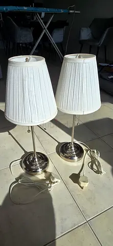 Pair of chrome bedside table lamps with pleated white shades
