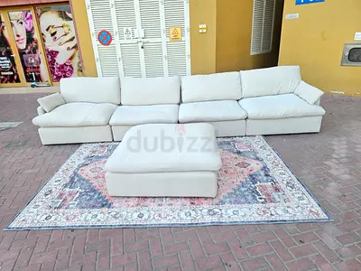 Home Center Sofa Beige Large Beige Modular Sofa with Ottoman and Decorative Rug