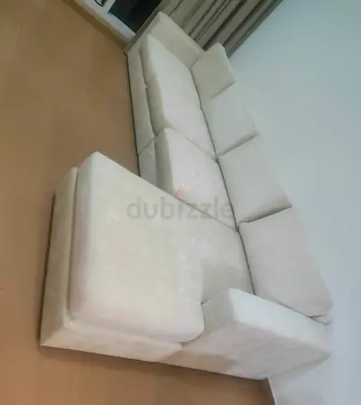 Home center beige color four seater lshape sofa