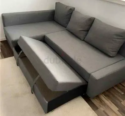 Grey L-shape Sofa with Pull-out Bed and Storage — Good Condition