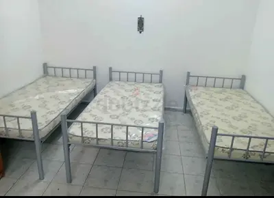 single metal beds with mattresses —