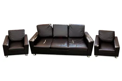 3-piece black faux leather sofa set (1 three-seater + 2 armchairs) - some wear