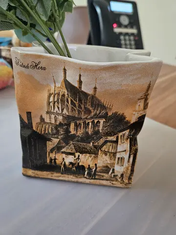 Charming vintage-style ceramic planter featuring a sepia-toned illustration of a historic European t