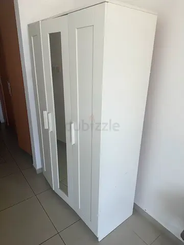 White 3-Door Wardrobe with Mirror - Good Condition. Left leg slightly chipped.