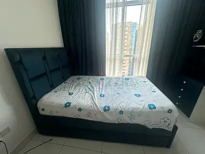 Blue bed with mattress