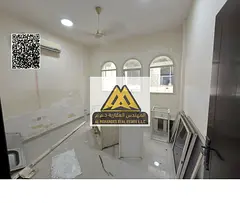 One-bedroom apartment with hall in Al Rawda 2, balcony, closed kitchen, split AC, fully renovated an