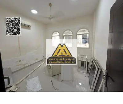 One-bedroom apartment with hall in Al Rawda 2, balcony, closed kitchen, split AC, fully renovated and maintained. 27,000 yearly, 4 payments, parking a