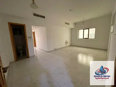 Two-bedroom apartment with a living room in Al Qasimia Station, rent AED 36,000, convenient payment in 6 installments, location close to services.