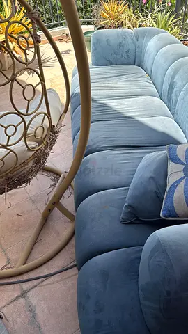 Blue velvet 3-seater sofa,indoor use with matching square ottoman. All in good condition.free