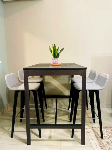 Bar table set with 4 grey upholstered stools - counter high dining set