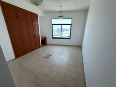 Three-bedroom apartment with a living room and a direct sea view for annual rent in Ajman Corniche