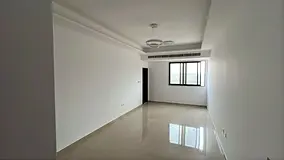 Large studio apartment in a prime location in Al Muwaihat 3, in a new building with central air cond