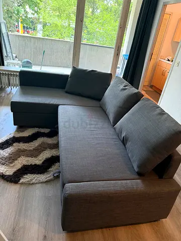 Gray L-shaped Sofa Bed with Storage - Good Condition