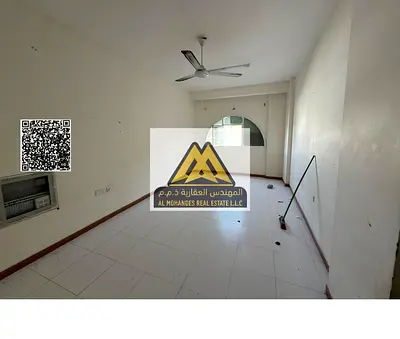 One-bedroom apartment with hall in Al Rawda 3, master bedroom, 2 bathrooms, closed kitchen, split AC, parking available. 23,000 yearly, 4 payments, cl