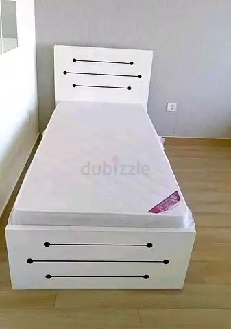 Single white bed frame with mattress — modern design