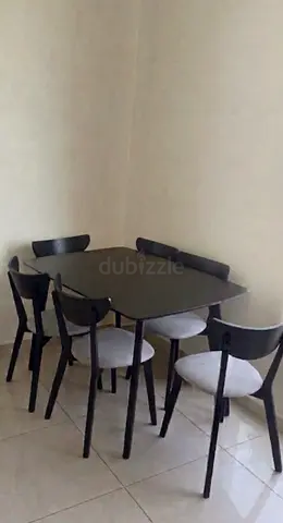 Dining table with 6 chairs - dark wood finish, good condition