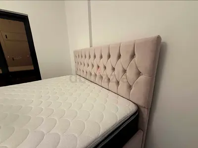 Queen upholstered tufted headboard bed frame in light beige - good condition