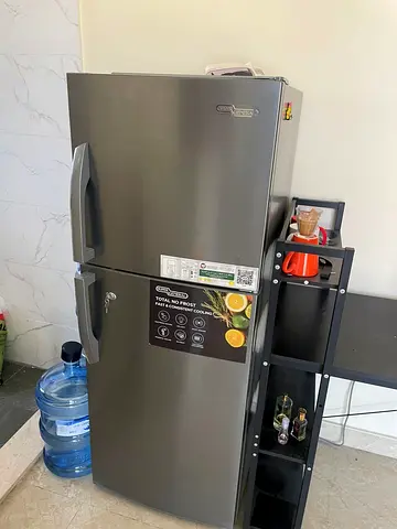 Grey double-door refrigerator, good condition