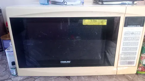 Used beige countertop microwave oven - Repair needed