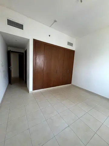 The finest and most luxurious two-bedroom apartment with a maid's room in Al Mamzar, Sharjah, with a lake and sea view, free air conditioning, gym, sw