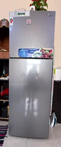 Silver two-door refrigerator in good working condition