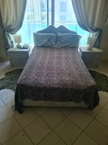 Double bed with side tables and leopard print bedding - set