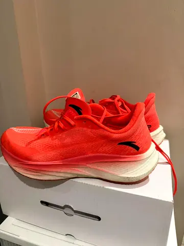 Used neon coral running shoes — lightly worn, size available
