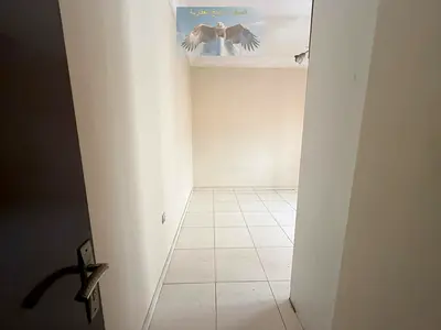One bedroom and living room for rent in al Nahda, spacious area, free maintenance
