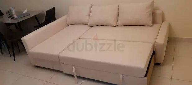 Beige L-shaped Sofa Bed with Storage - Good Condition
