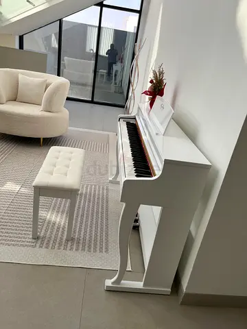 White digital upright piano with bench – gently used
