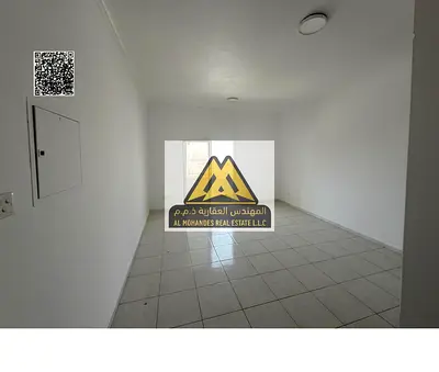 One-bedroom apartment with hall in Al Rashidiya 3, balcony, built-in wardrobes, central AC. 27,000