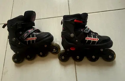Pair of black inline roller skates (adjustable) - used