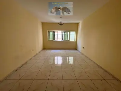 One-bedroom apartment with built-in wardrobes, spacious layout, easy access to Dubai, available for annual rent in Al Khan, Sharjah.