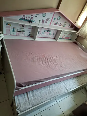 White and Pink Childrens Bed with Storage Shelves and Pull-Out Trundle