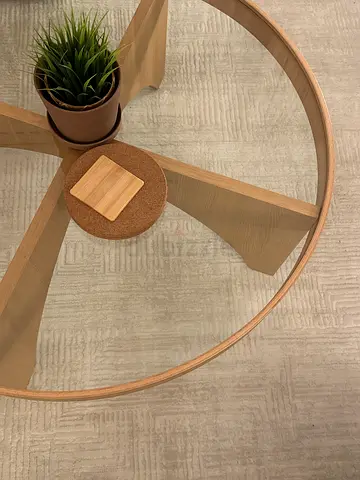 Round coffee table with veneer glass