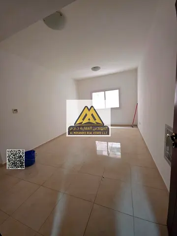 One-bedroom apartment with hall in Al Jurf 2, balcony, near Ajman University, lively and serviced l