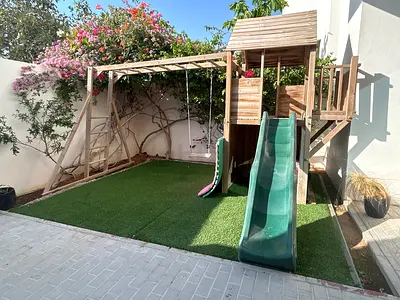 Wooden outdoor playset with slide, swings and climbing ladder - good condition