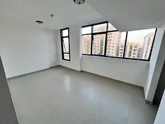 Three-bedroom apartment with a living room, brand new first tenant located on Al Ittihad Street near