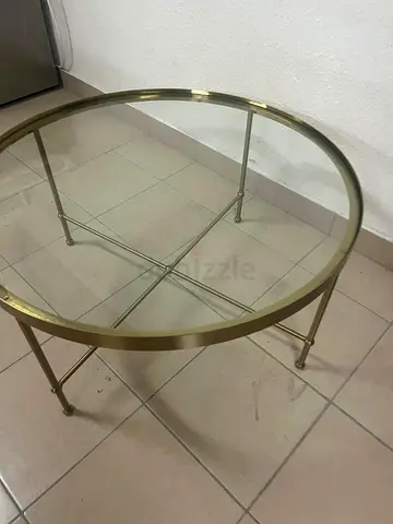 TORSJÖ coffee table in gold and glass from IKEA.