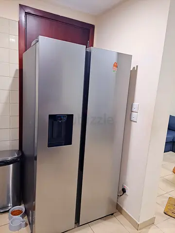 LG Stainless Steel Side-by-Side Refrigerator with Water Dispenser - Good Condition