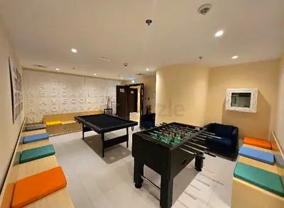 Wooden storage with cushions for sitting (lounge / play area / coffee area use)