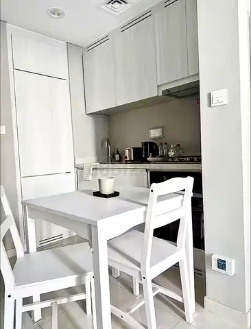 Compact white dining table with 2 chairs — perfect for small kitchen
