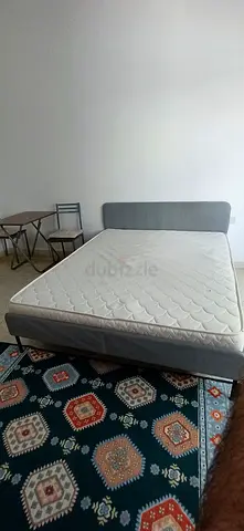 Queen bed frame with mattress — good condition