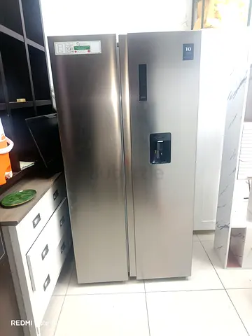 Stainless Steel Side-by-Side Refrigerator with Water Dispenser - Excellent Condition