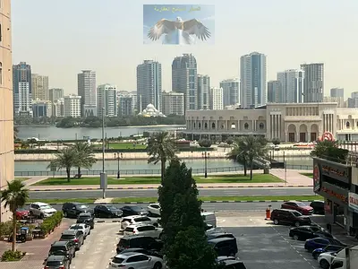 Beautiful & cheapest 3BR + living room in Al Majaz 3, balcony, open view, split AC, prime location near all services, close to Dubai exit.